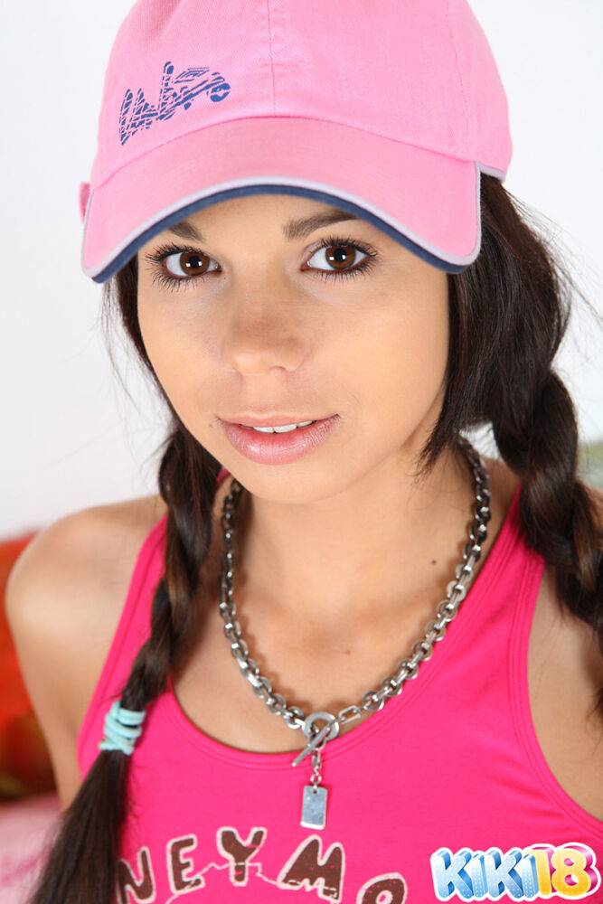 Cute teen Kiki 18 sports pigtails and a ballcap while having sex on a bed - #14