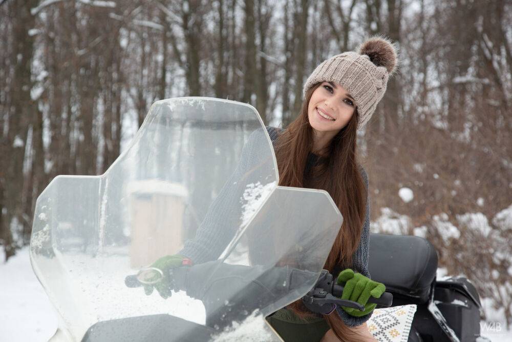 Teen model Leona Mia shows her tits and twat atop a snowmobile in the winter - #2