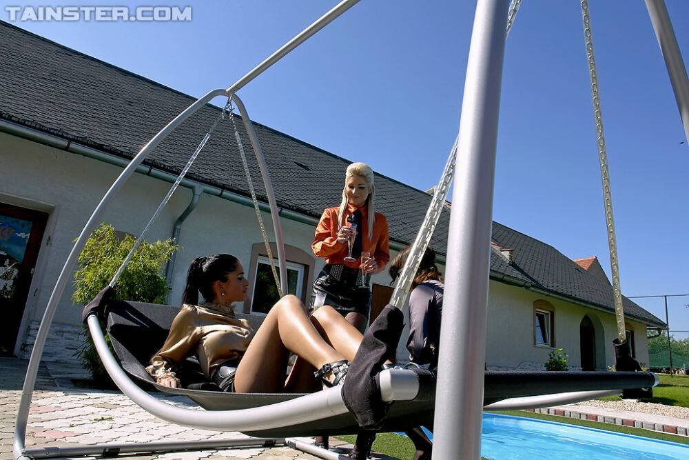 Nessa Devil is into fully clothed lesbian threesome by the pool - #15