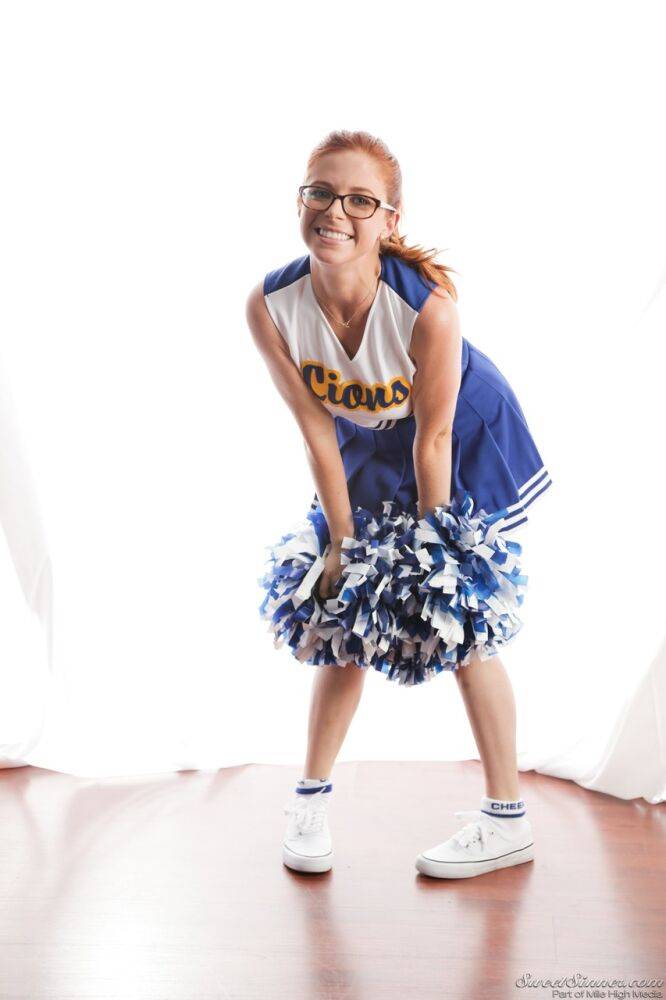 Cute redhead cheerleader Penny Pax in glasses baring big tits & firm ass - #2