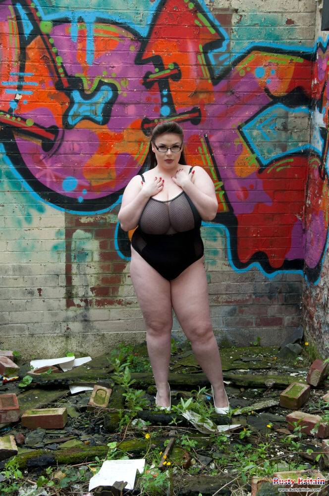 Brunette fatty Gina G unleashes her knockers while getting naked near graffiti - #10