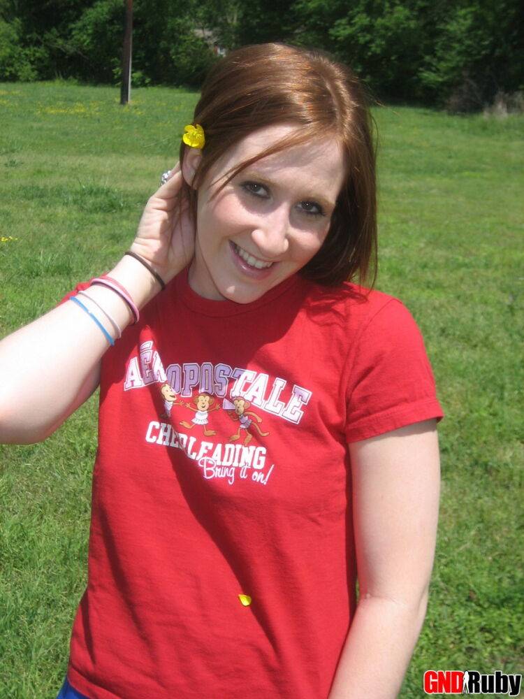 Teenage slut Ruby flashes her perky tits out in the park while picking flowers - #6