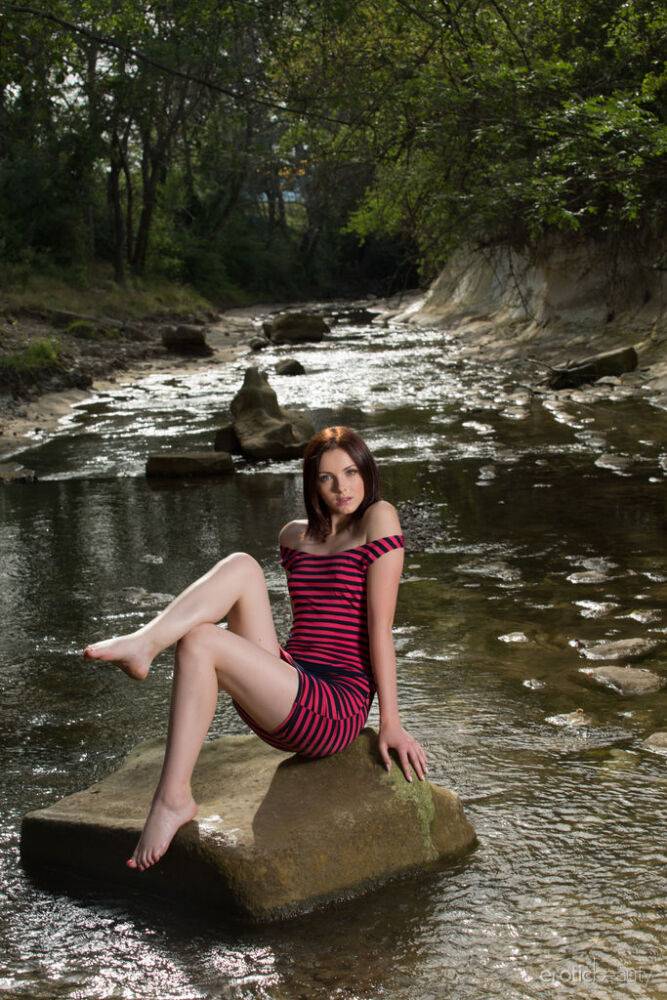 Teen solo girl Cordoba gets totally naked in a shallow stream - #11