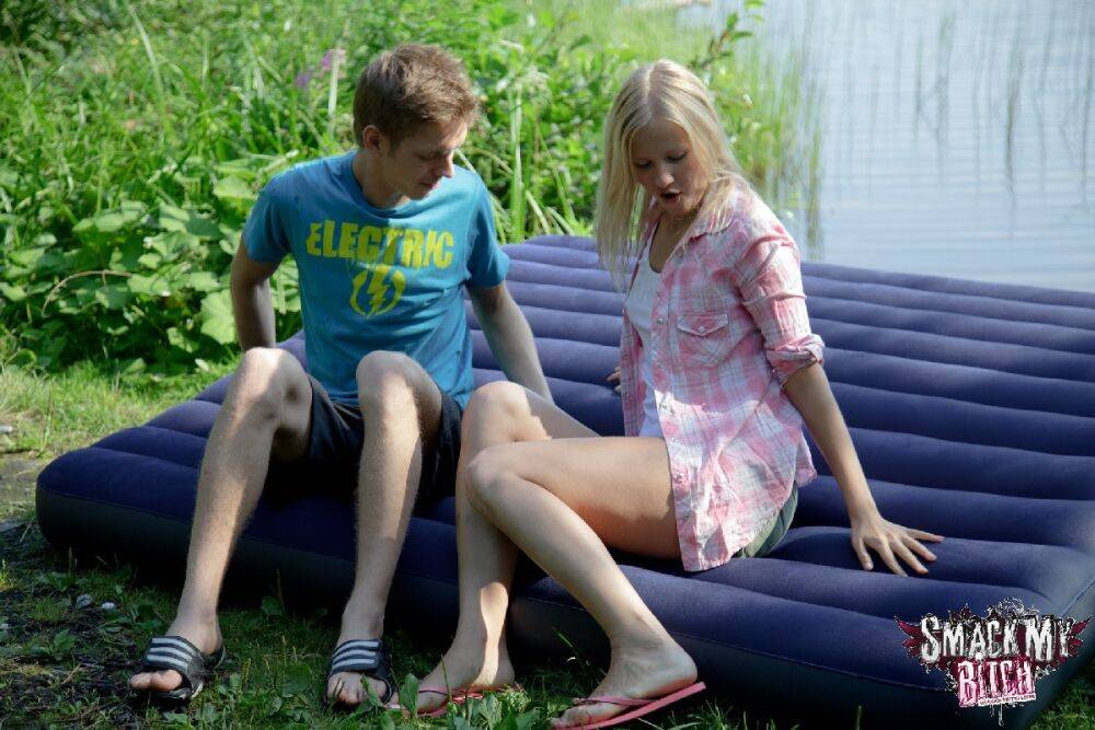 Blonde teen and her boyfriend have sex on an air mattress near a lake - #5