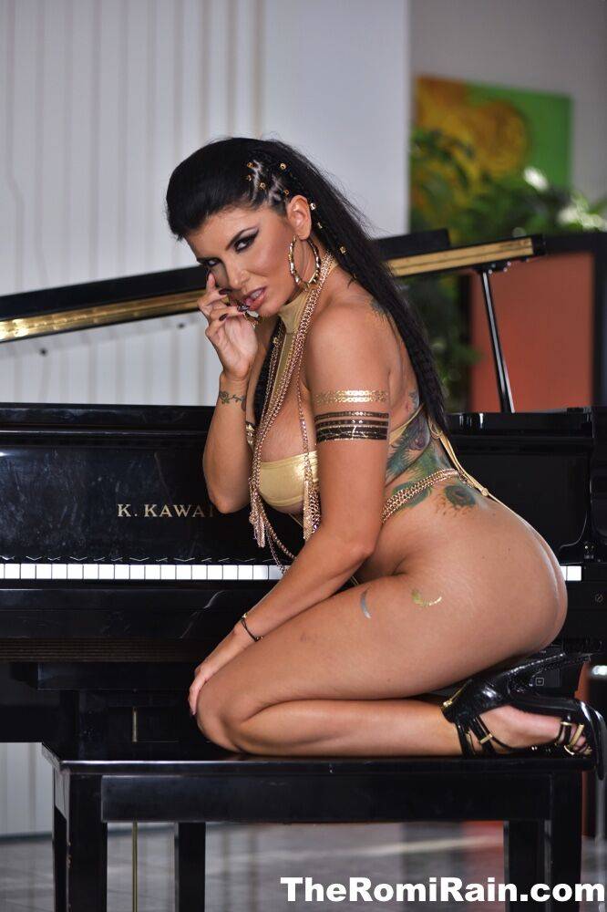 Sexy MILF Romi Rain exposes her big tits and pussy on a piano bench - #12