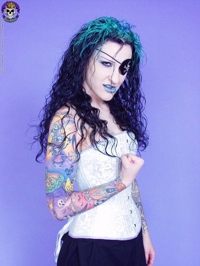 Gothic tattooed pirate girl smirks sexy - #1