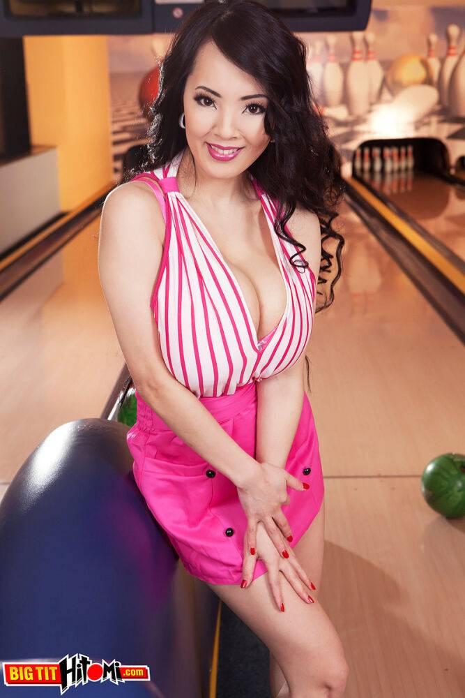 Asian cutie Hitomi whips out hr monster boobs at the bowling alley - #10