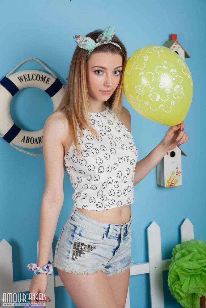 Innocent teen girl uncovers her big natural tits while posing with balloons - #4