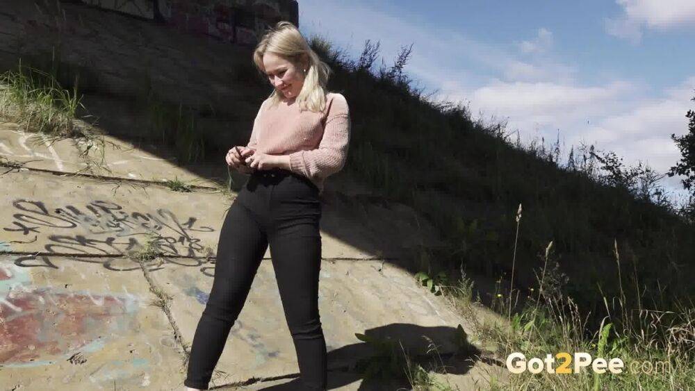 Blonde girl Nastya pulls down her pants for a badly needed pee in the outdoors - #6