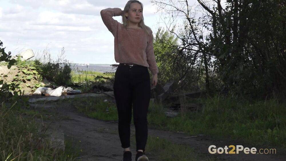 Blonde girl Nastya pulls down her pants for a badly needed pee in the outdoors - #14