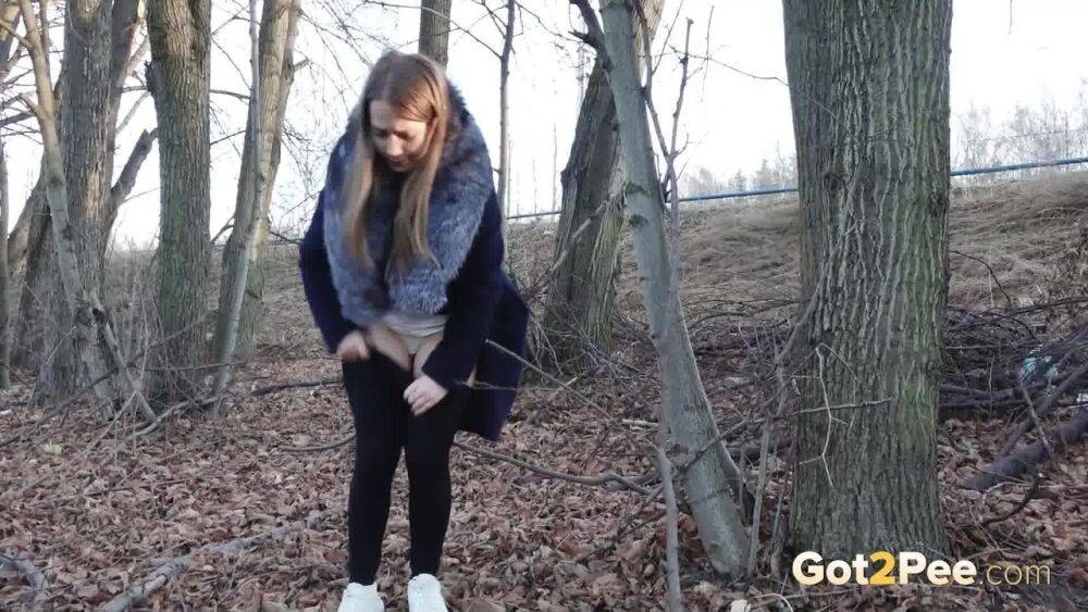 Short taken girl pulls down tights to take a pee while walking thru the woods - #2