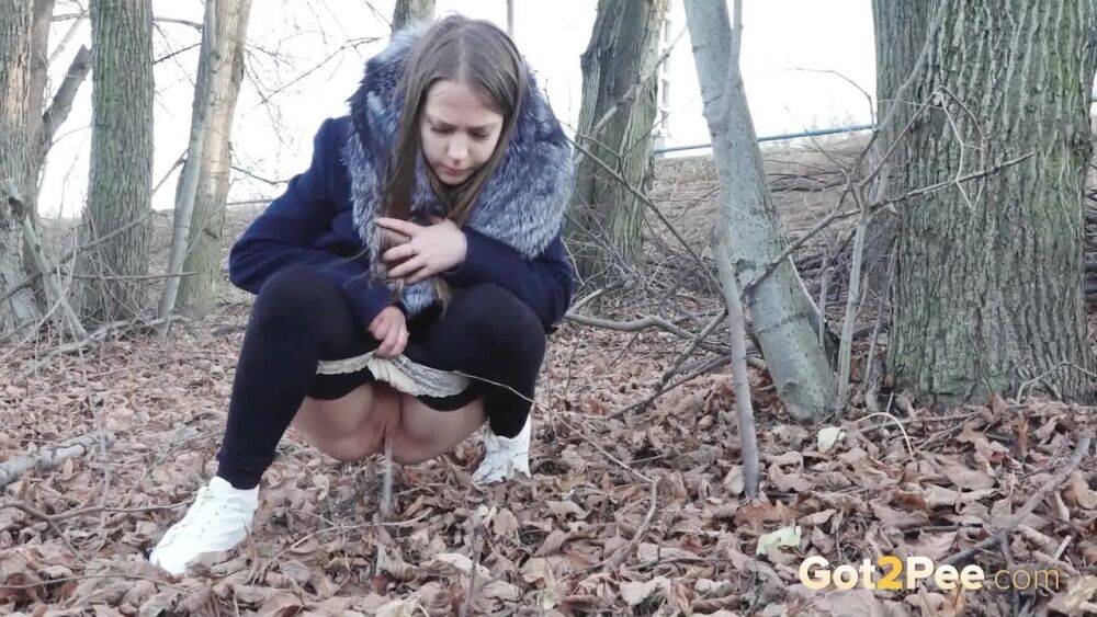 Short taken girl pulls down tights to take a pee while walking thru the woods - #5