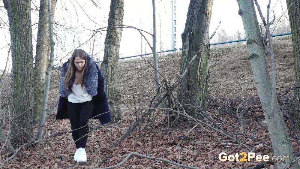 Short taken girl pulls down tights to take a pee while walking thru the woods - #3