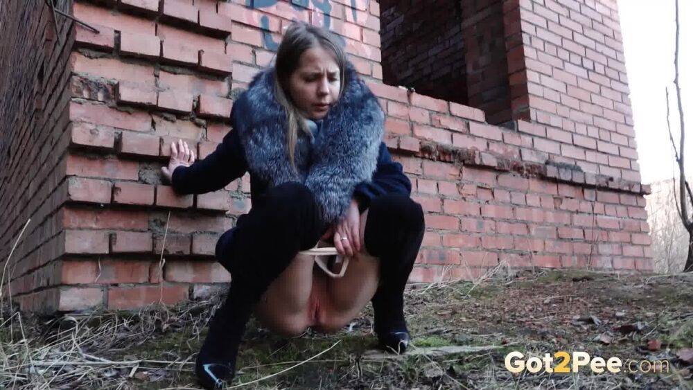 Distressed girl Nastya pulls down her tights to pee by an abandoned building - #3