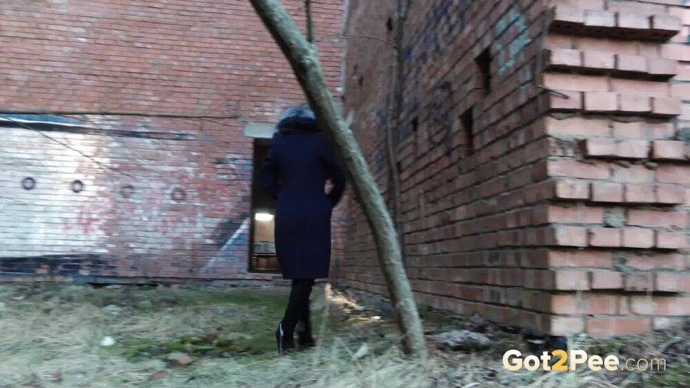 Distressed girl Nastya pulls down her tights to pee by an abandoned building - #12