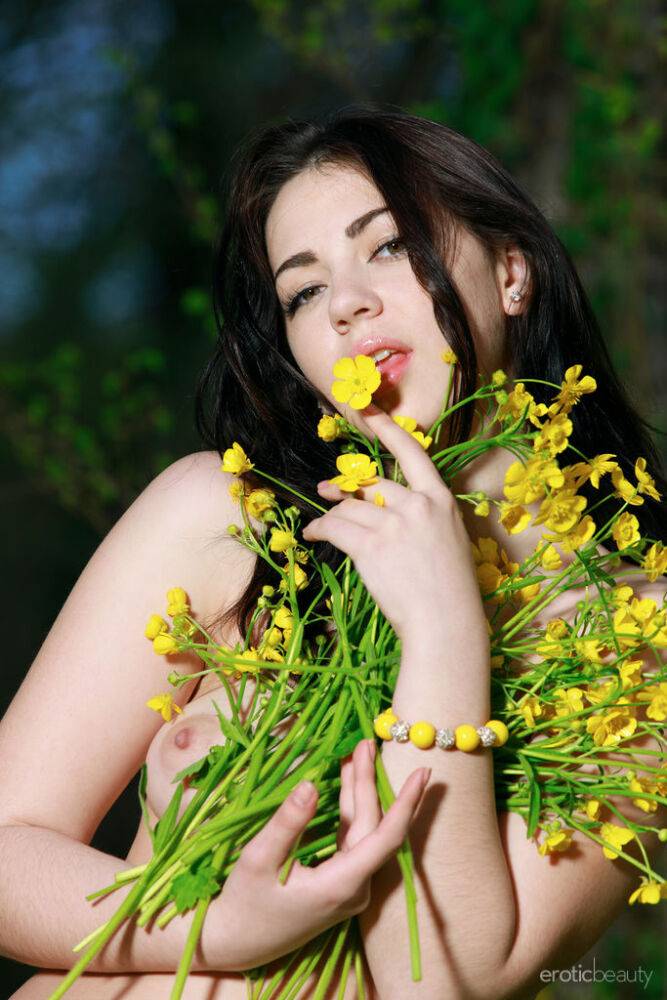 Young brunette Sivilla picks wild flowers while showing her great body - #11