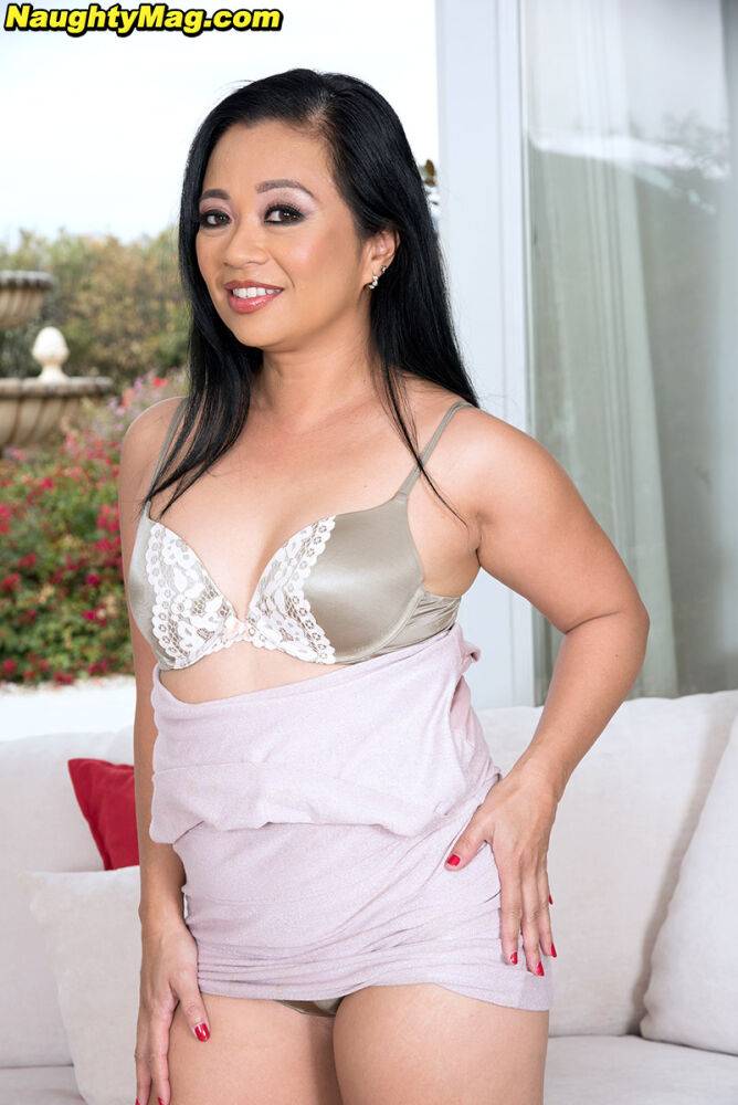 Asian MILF Lucky Starr uncovers her tiny tits as she strips to satin underwear - #15