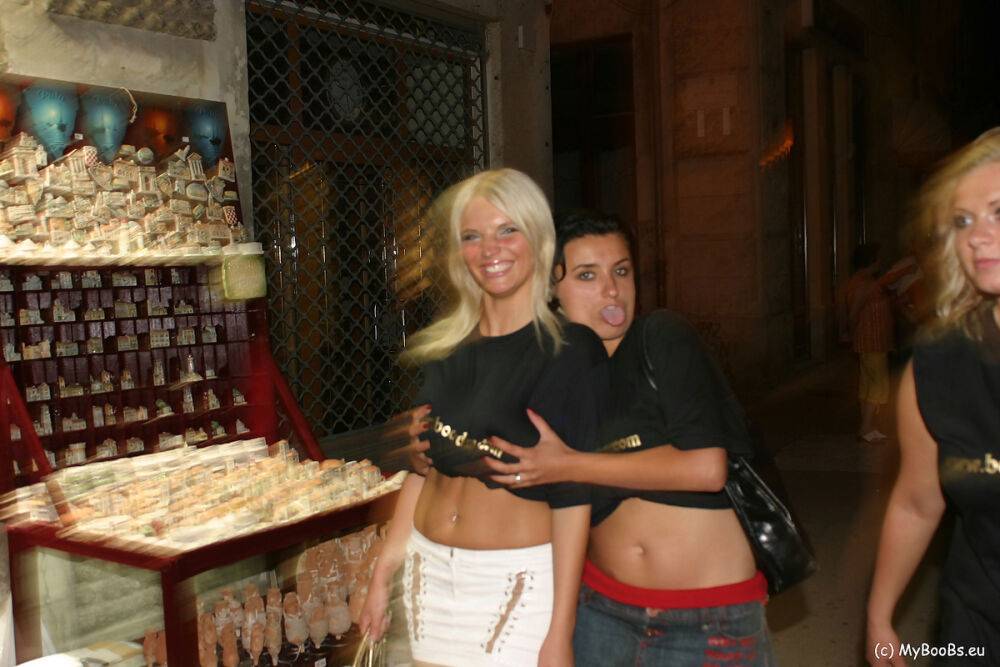 Three girls flash their natural tits while walking a city street at night - #6