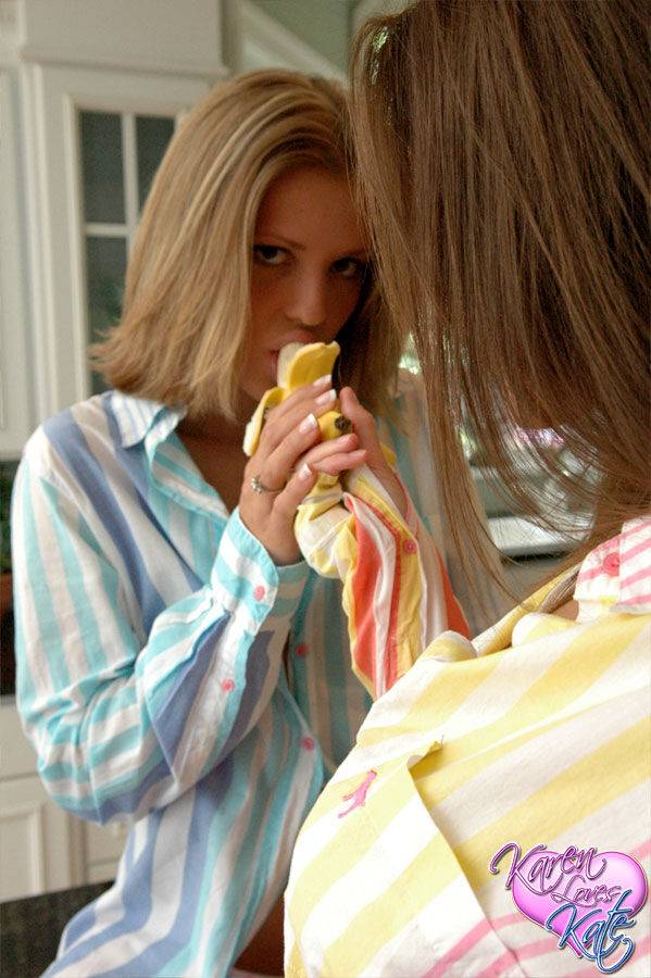 Teen lesbians Karen and Kate fool around with a banana in their pajamas - #3