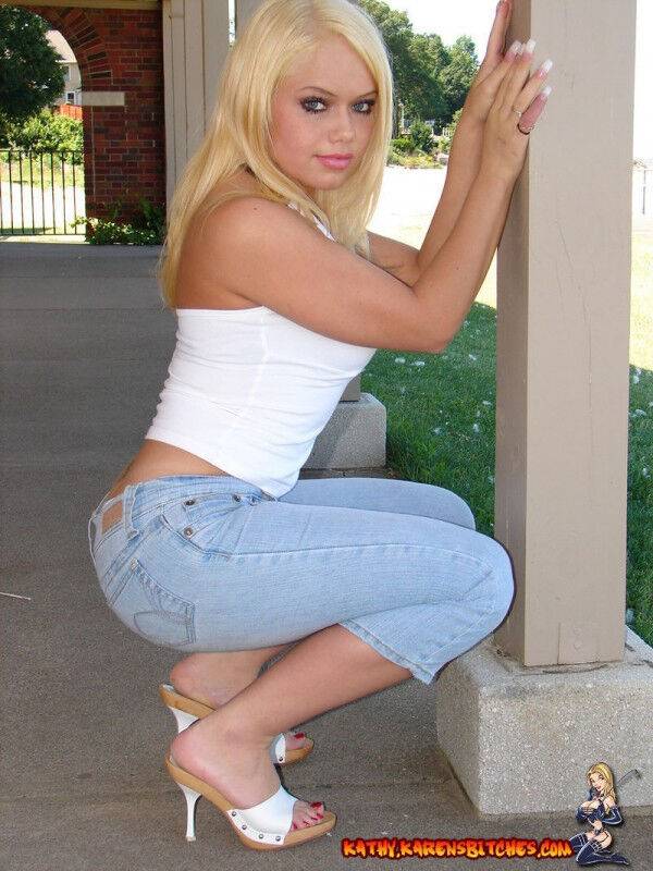 Blonde amateur Karen exposes her lace thong while outdoors in faded jeans - #7