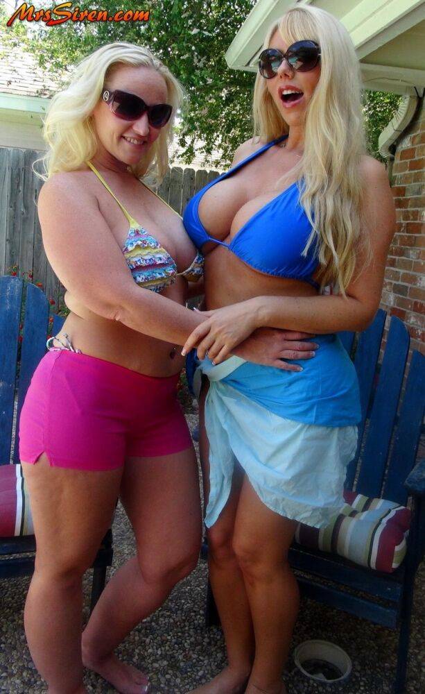 Blonde chicks Karen Fisher and Dee Siren loose their big tits from bikini tops - #10