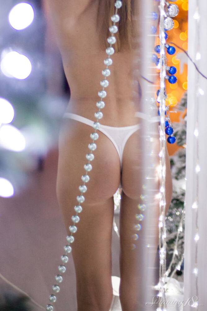 Barely legal girl Candy N gets totally naked amid Christmas lights - #9