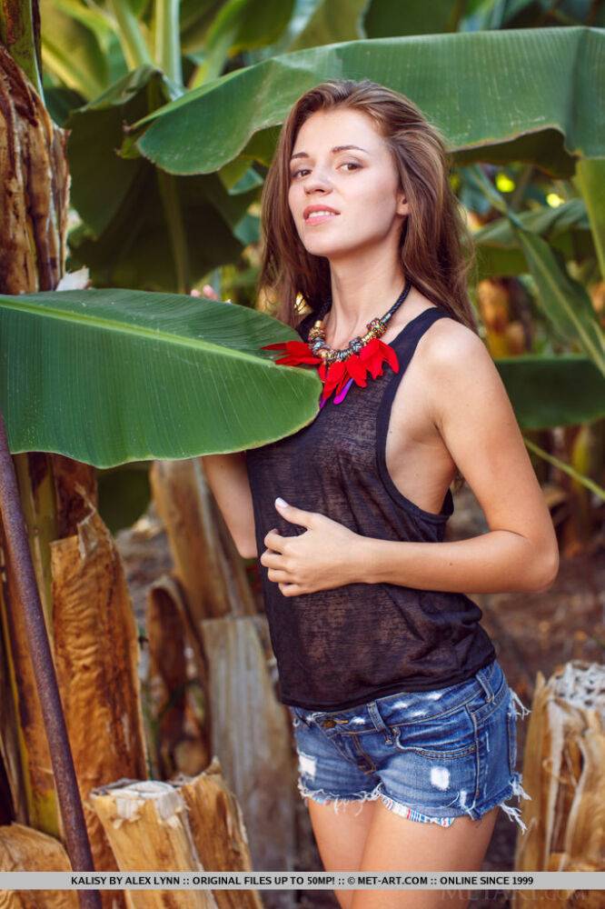 Clothed solo girl in denim shorts revealing flat teen chest outdoors - #1