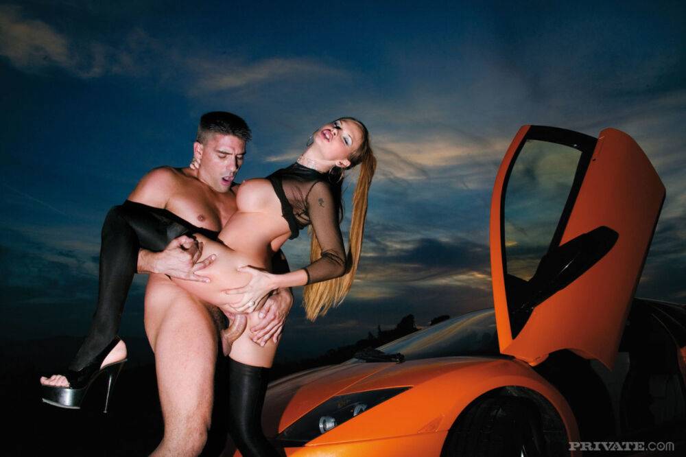 Redhead pornstar in black stockings gets banged on the hood of sports car - #7