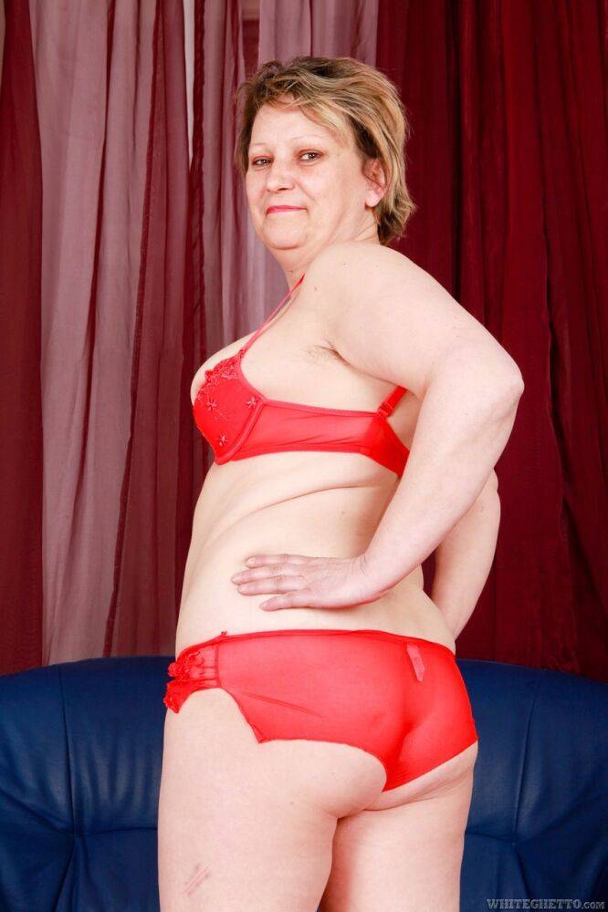 Thick mature lady Carmen T strips to red bra and panty set in bare feet - #2