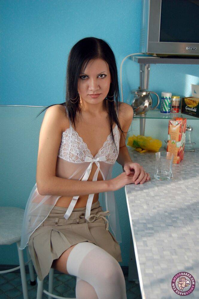 Thin brunette strips to white over the knee stockings on kitchen stool - #13