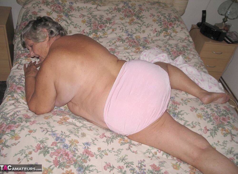 Old woman Grandma Libby grabs her fat roll after getting naked on a bed - #3