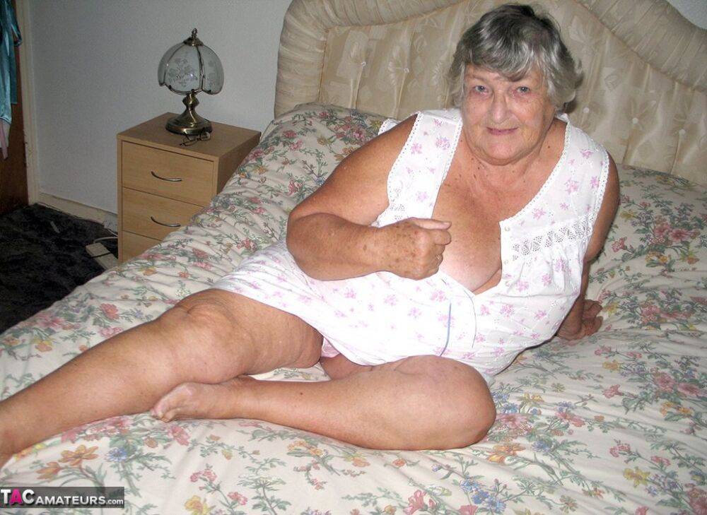 Old woman Grandma Libby grabs her fat roll after getting naked on a bed - #14