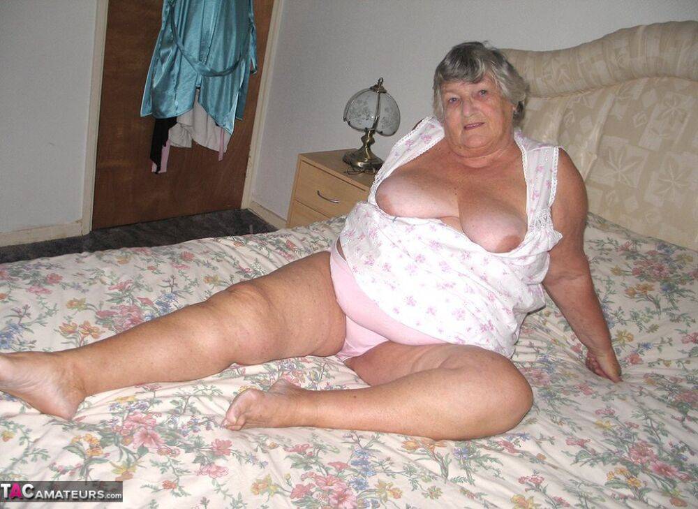 Old woman Grandma Libby grabs her fat roll after getting naked on a bed - #11