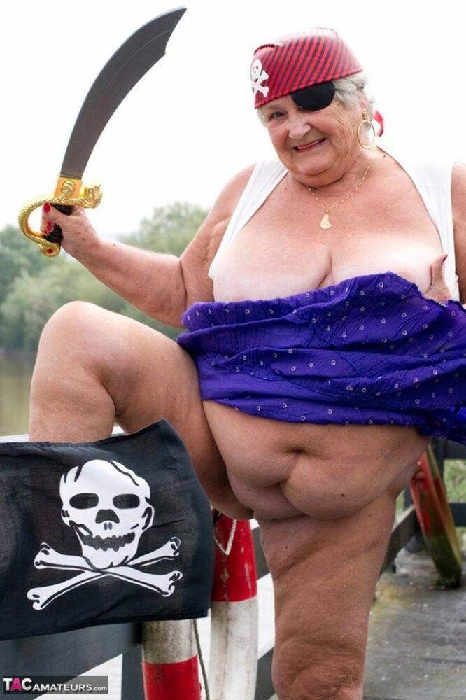 Fat British granny exposes herself on a bridge while sporting pirate attire - #15