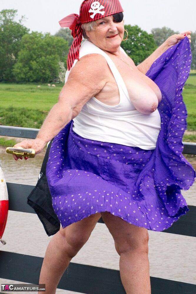 Fat British granny exposes herself on a bridge while sporting pirate attire - #4