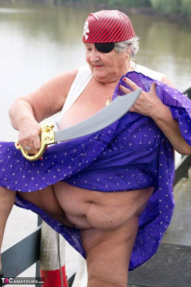 Fat British granny exposes herself on a bridge while sporting pirate attire - #14