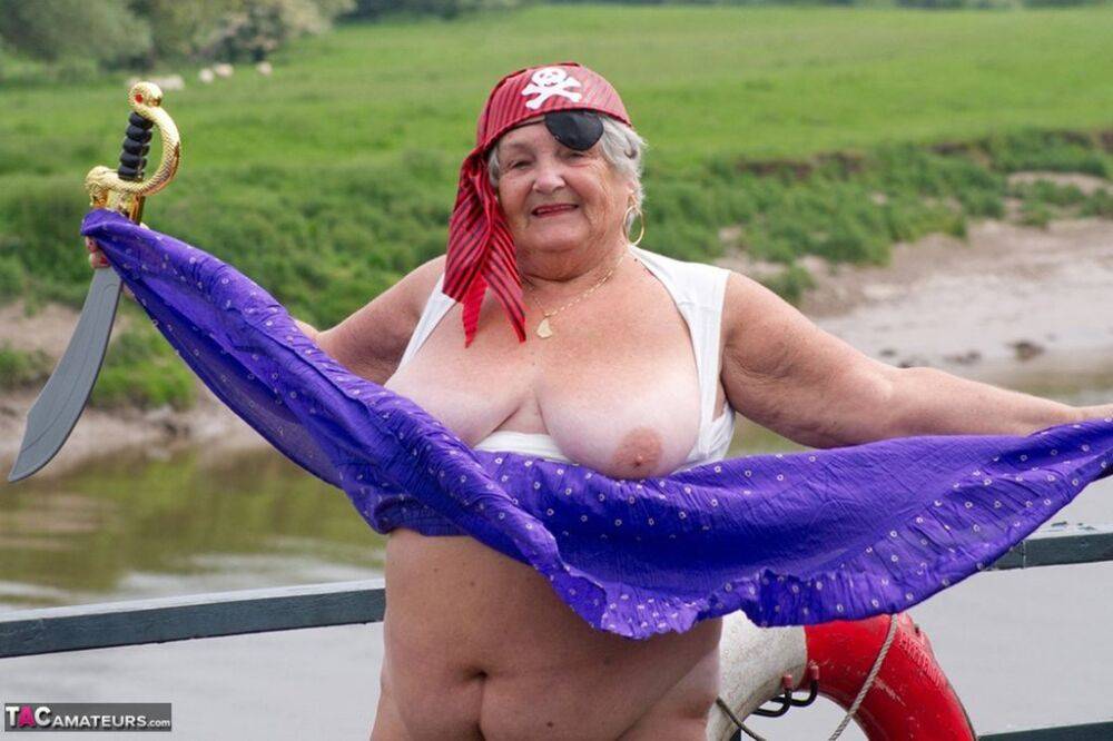 Fat British granny exposes herself on a bridge while sporting pirate attire - #11