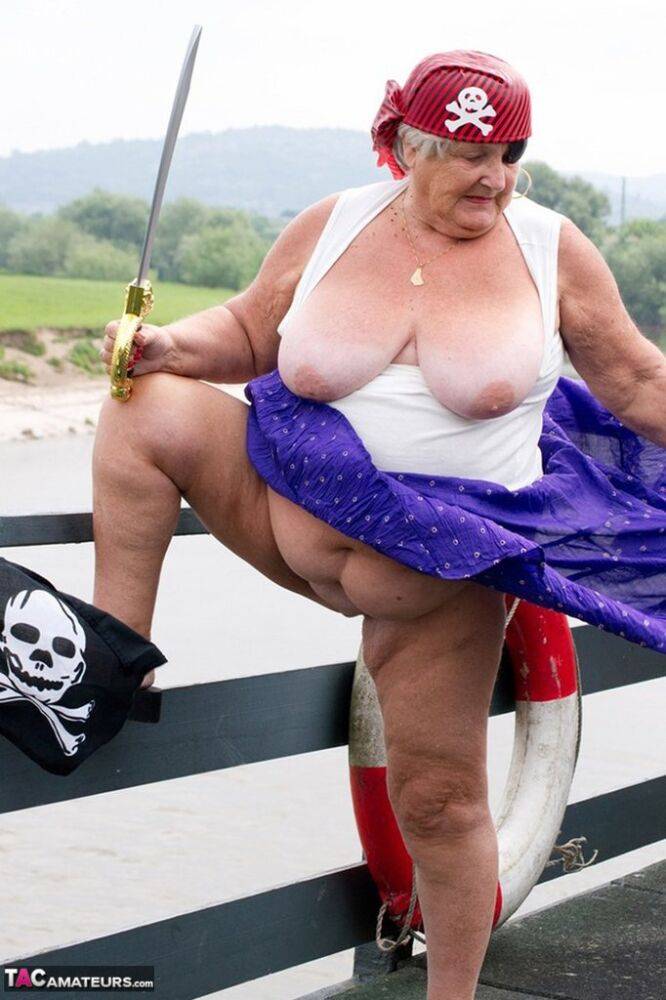 Fat British granny exposes herself on a bridge while sporting pirate attire - #9