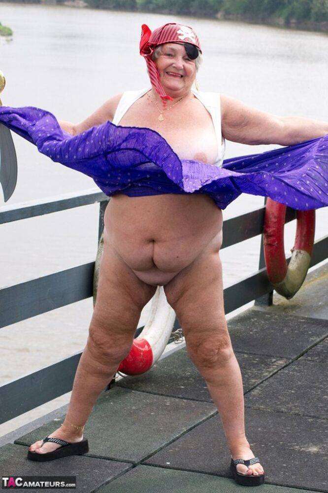 Fat British granny exposes herself on a bridge while sporting pirate attire - #6