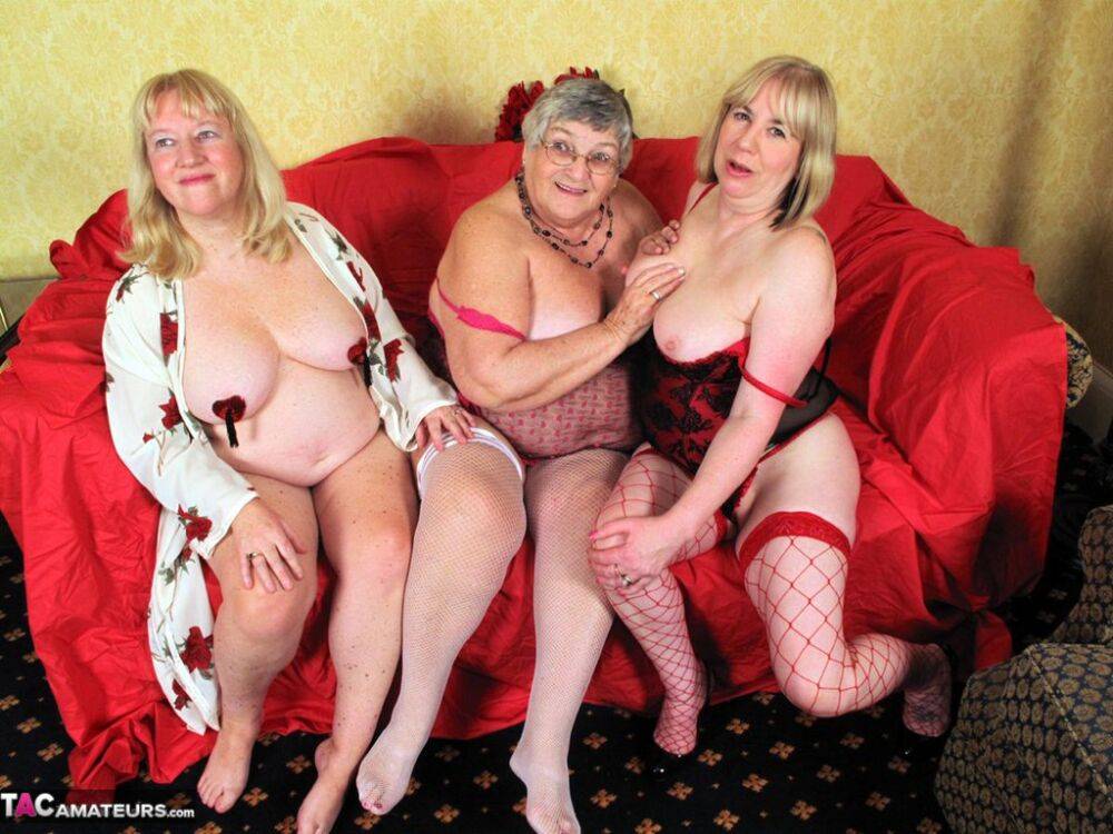 Fat nan Grandma Libby fondles a couple of older women's vaginas on a loveseat - #2