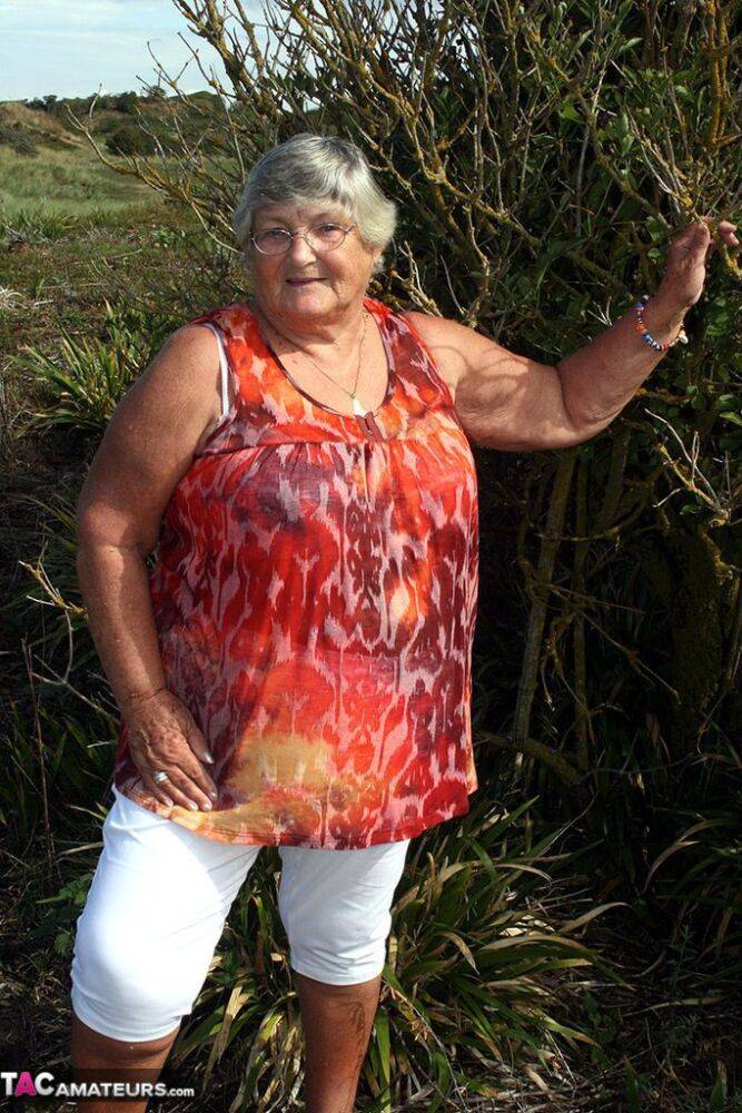 Obese nan Grandma Libby strips totally naked out by evergreen trees - #16