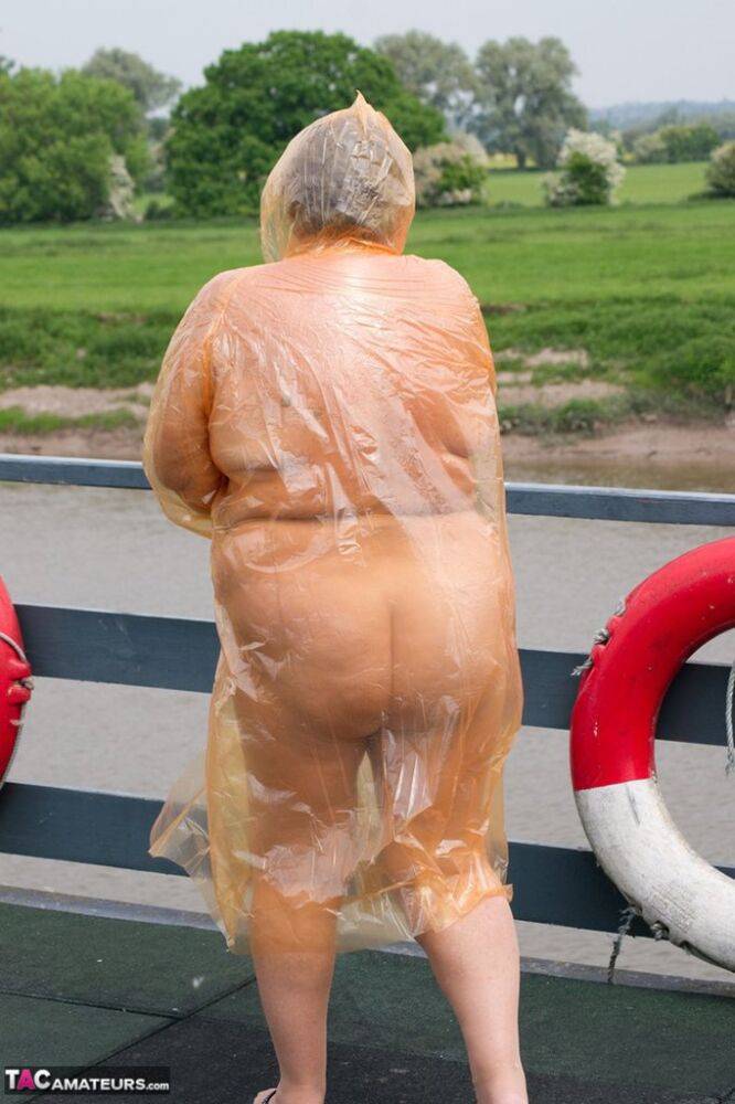 Obese oma Grandma Libby doffs a see-through raincoat to get naked on a bridge - #12