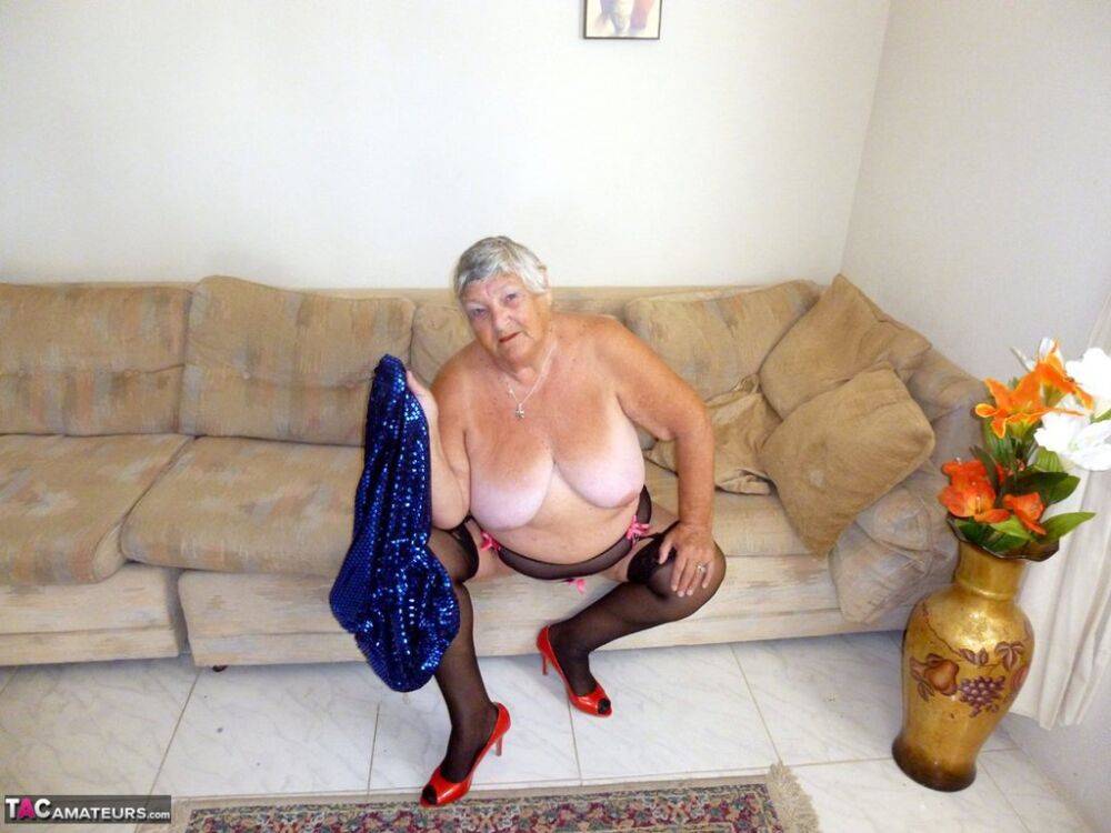 Overweight British woman Grandma Libby plays with herself on a sofa in nylons - #16