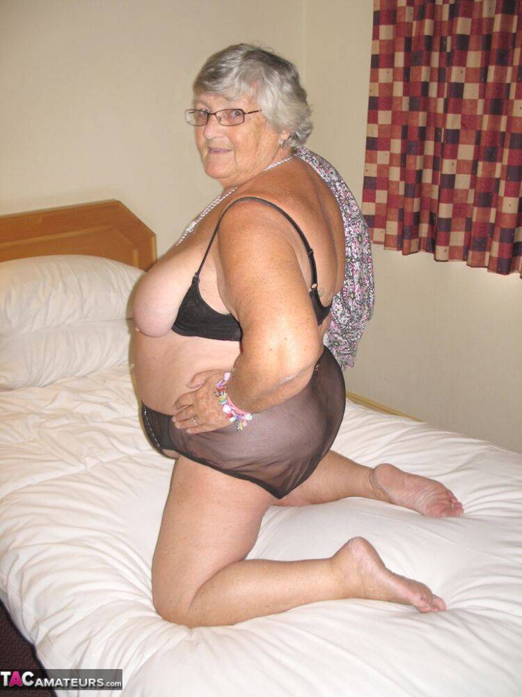 Silver haired British woman Grandma Libby exposes her fat body on a bed - #1