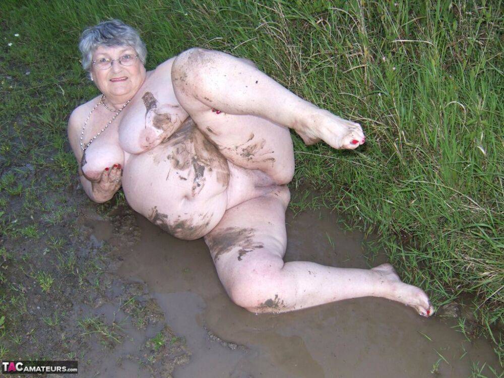 Fat nan Grandma Libby steps into a puddle before covering herself in mud - #15