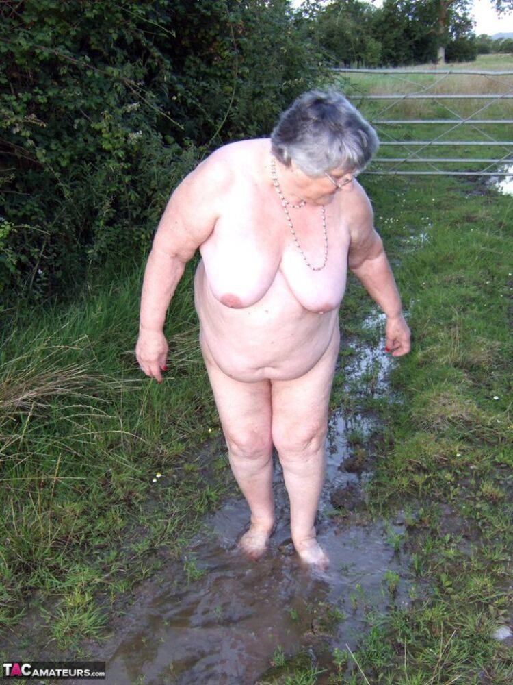 Fat nan Grandma Libby steps into a puddle before covering herself in mud - #13