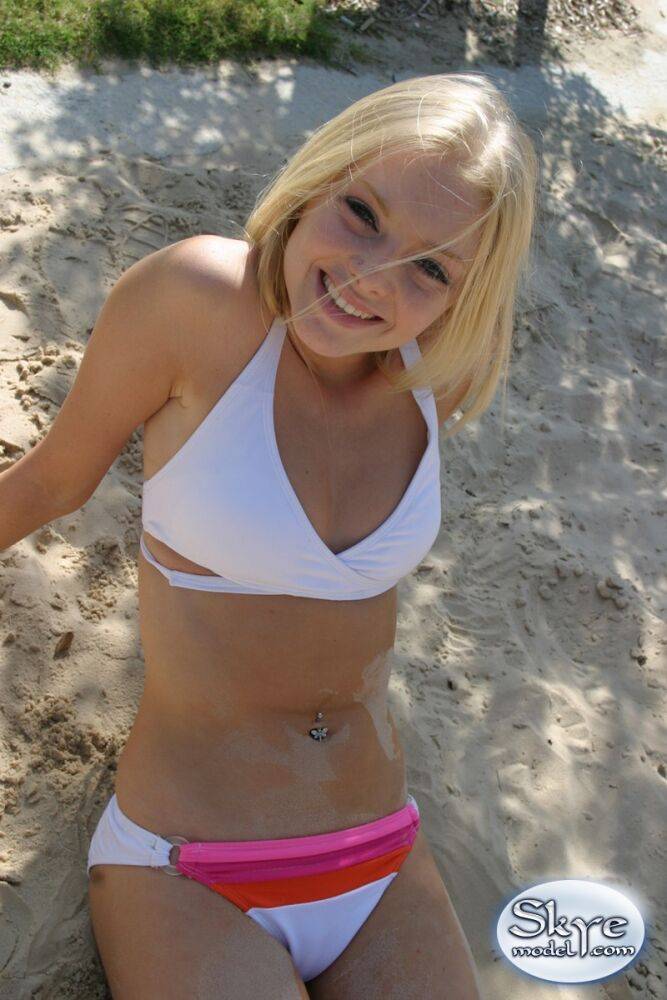 Petite teen Skye Model wearing sexy white bikini and flip flops on the beach - #12