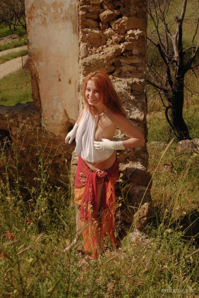 Natural redhead Aelit gets naked in white gloves by a ruined building - #9