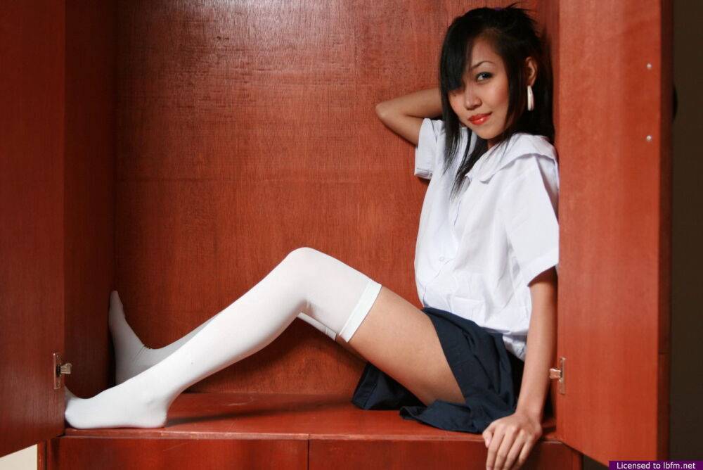 Asian schoolgirl strips to white thigh highs before showcasing her tight slit - #7