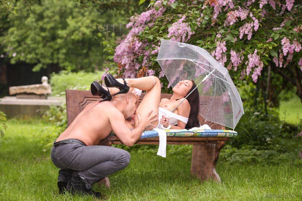 White girl El Storm holds a parasol before intercourse on a park bench - #10